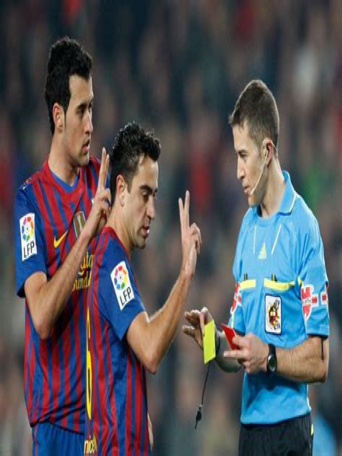 How many trophies did Xavi Iniesta and Busquets win together?